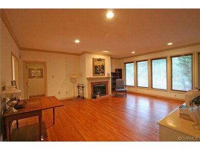 Family Room with gas log fireplace and large windo