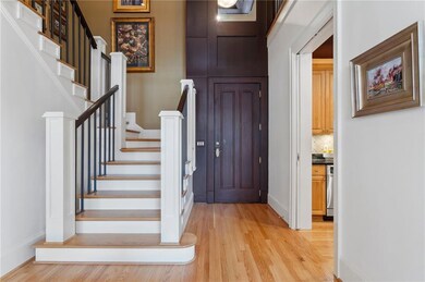 Entrance foyer with light wood finished floors, st