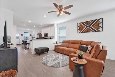 This spacious living room features high ceilings,