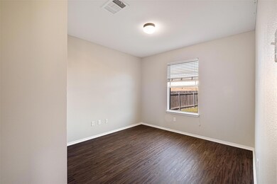 Unfurnished room featuring dark wood-style floors