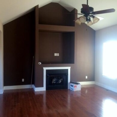 Great room with vaulted ceiling, fireplace and noo