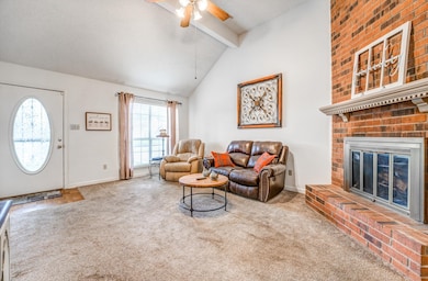 Carpeted living room featuring plenty of natural l