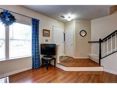 Hardwood entry and new carpet on stairs.