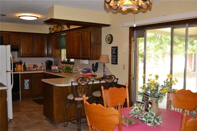 Breakfast area, kitchen and back yard.