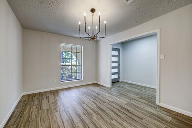 Another view of the Dining Room and Foyer entryway