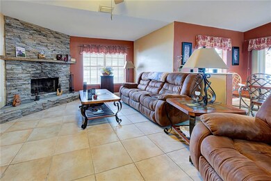 Living room with wood burning fire place.