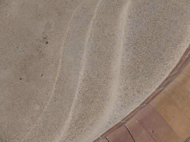 CLOSE DETAIL OF PEBBLE TEC AND PAVERS