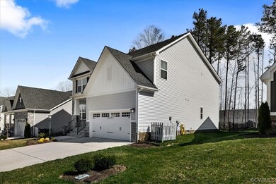 DOUBLE WIDTH DRIVEWAY LEADS TO 2 CAR GARAGE