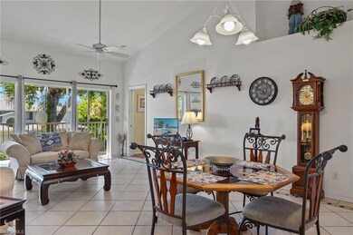 Dining space with high vaulted ceiling, ceiling fa