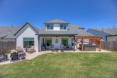 Beautiful backyard with extended patio, hot tub, a