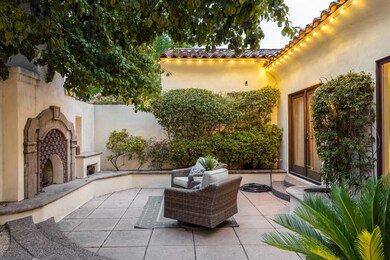 Gated Front Courtyard with Fireplace