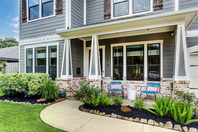 Lush landscaping augments the exterior of this Oak