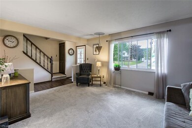 Newer vinyl-plank flooring leads from the front do