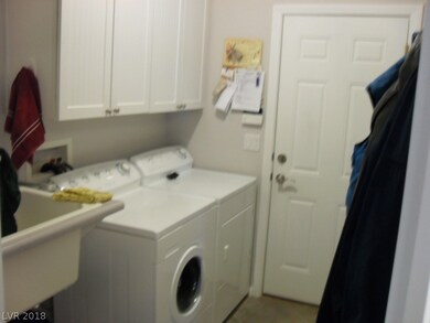 Laundry with sink. Door to the garage