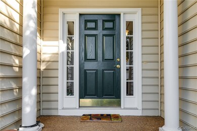Covered front entry with columns and privacy glass