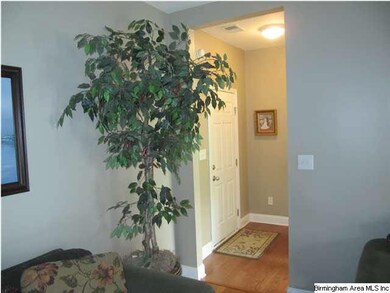 Family Room to powder bath, bonus room, and garage