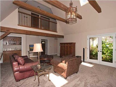 great room...2 story beamed ceiling...french doors