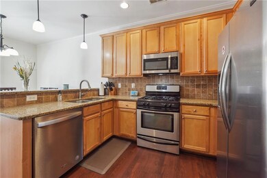 Kitchen with kitchen peninsula, appliances with st