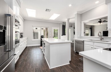 Another angle of the enormous kitchen featuring the sit-in island