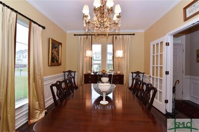 DINING ROOM LOOKING ONTO FRONT DOOR HALLWAY