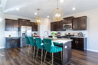 Stunning kitchen with huge island, granite and sta