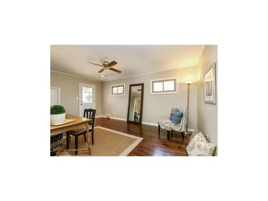 Family room with door that leads to back patio.