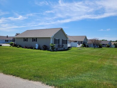 Side & back lawn of condo