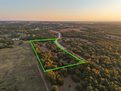 Aerial view at dusk of property boundaries highlighted