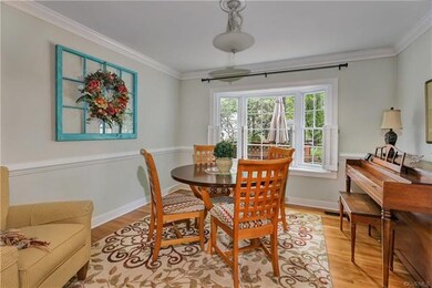 Dining Room - Wood floors, crown moulding, chairra