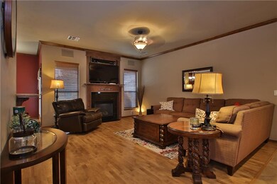 Living area with Wood Floor, Surround Sound, Firep