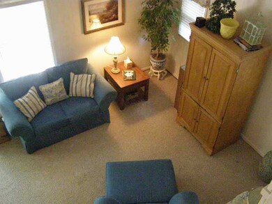 Spacious great room has vaulted ceilings and plent