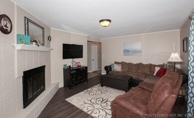 2nd living room with corner brick fireplace. New f