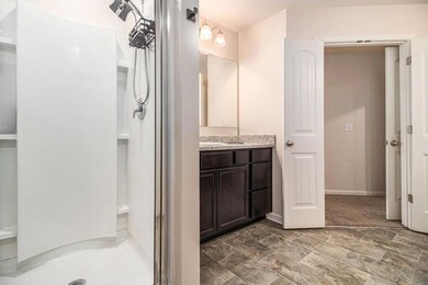 Upstairs, retreat to the Primary Suite with a Walk-In Closet and Private Ensuite Bath complete with a Dual Vanity and Shower