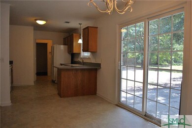 Large joining kitchen and walk out sliding door.