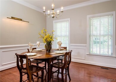 Another view of the dining room with large windows facing the front of the house.