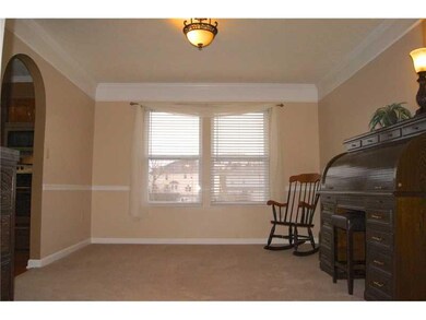 Dining Room. Tasteful window treatments on all lev