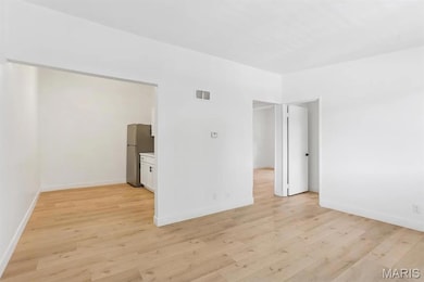 Empty room with light wood-type flooring