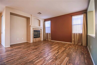 Family Room with Fireplace that open up to the Kit