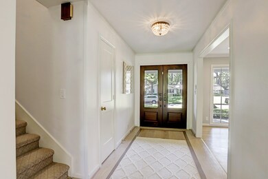 Inviting entry opens onto the dining room and fami