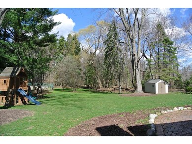 Large backyard with brick Patio and newer storage shed