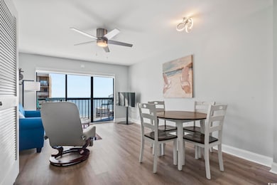 Dining area with hardwood / wood-style floors and 
