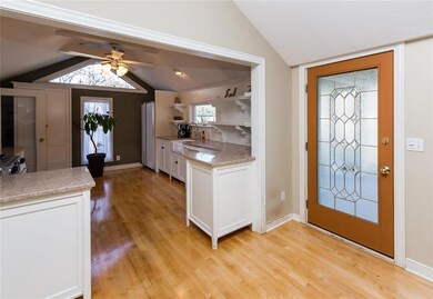 FRONT ENTRY DOOR OPENS TO KITCHEN & LIVING ROOM!
