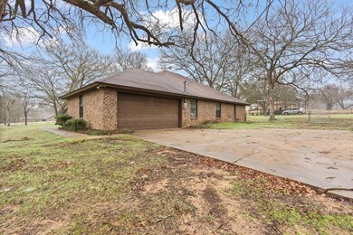 View of home's exterior with a lawn