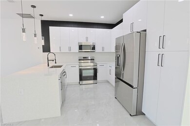 Kitchen with modern cabinets, a sink, white cabine