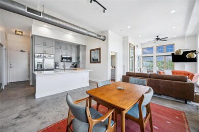 Dining space featuring concrete floors, a ceiling