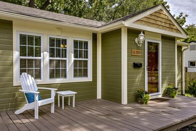 Beautiful front porch greets guests and welcomes t