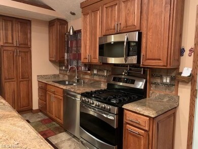 Enjoy cooking in this space. Cabinets abound!