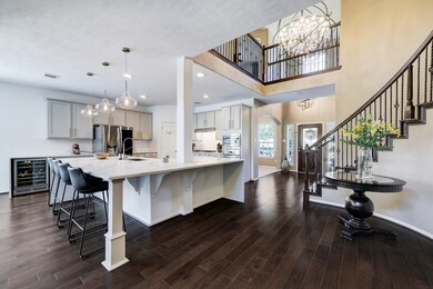 Another look at the high ceilings, wood floors, and updated elegance of this home.