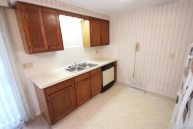 Kitchen with beautiful oak cabinets & Dishwasher