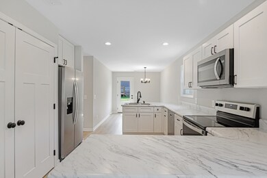 Double doors on left are laundry room, soft close cabinets, dishwasher and plenty of storage